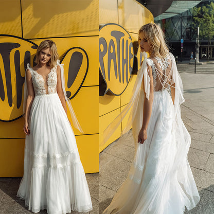 Flowy Tiered Maxi Dress with Deep V-Neck and Lace Bodice