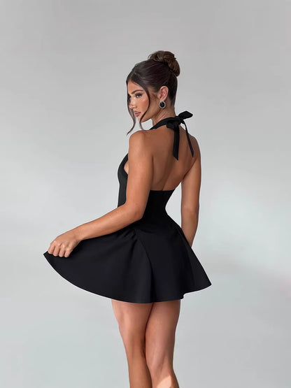 Backless Halter Mini Dress with Deep V-Neck and Pleated Skirt