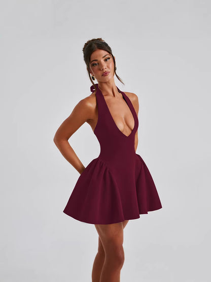 Backless Halter Mini Dress with Deep V-Neck and Pleated Skirt