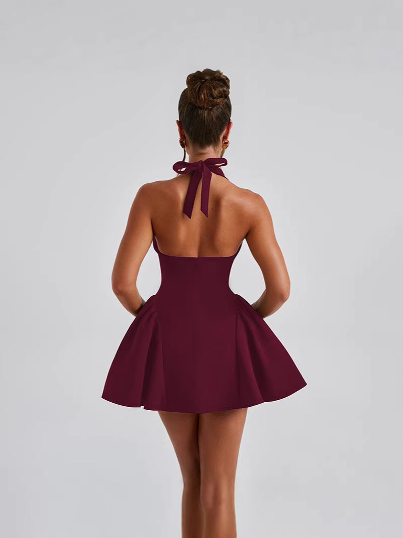 Backless Halter Mini Dress with Deep V-Neck and Pleated Skirt