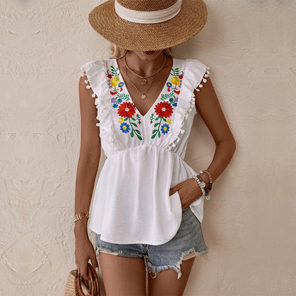 Embroidered Floral Peplum Top with V-Neck and Pom-Pom Trim