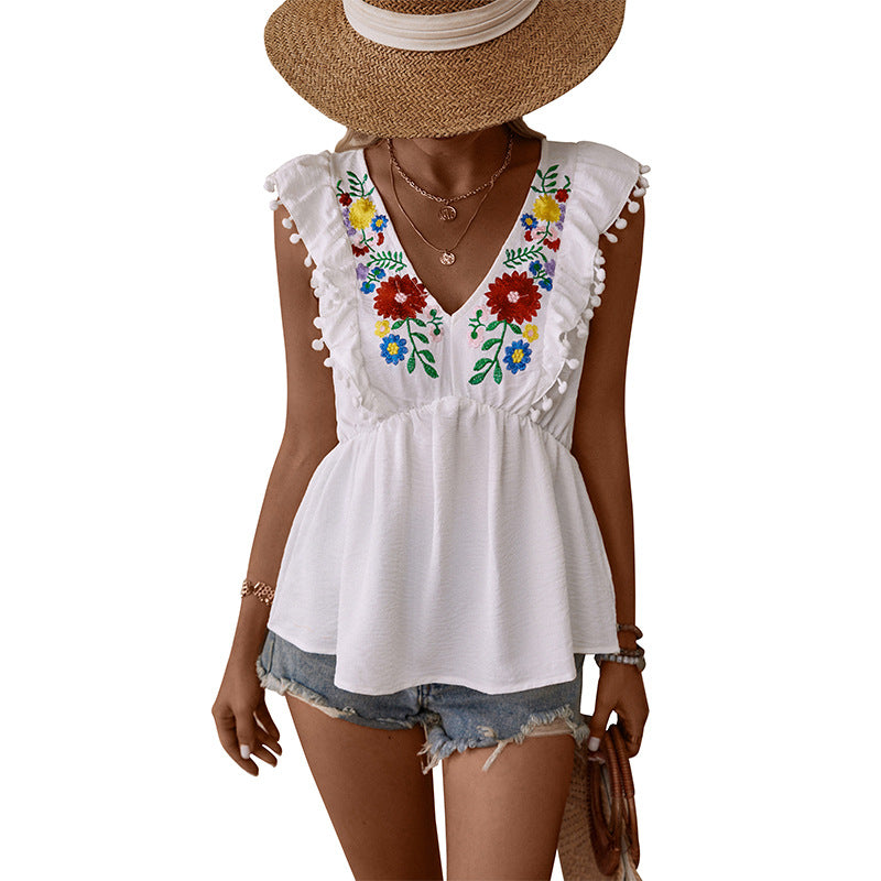 Embroidered Floral Peplum Top with V-Neck and Pom-Pom Trim