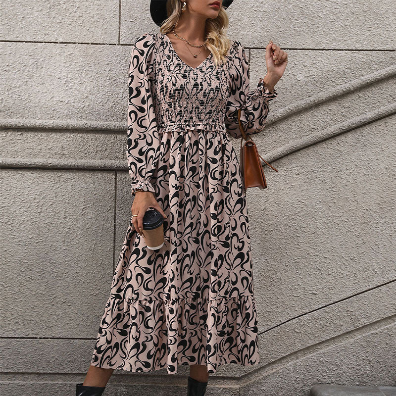 Abstract Print Dress with V-Neck and Smocked Bodice