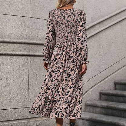 Abstract Print Dress with V-Neck and Smocked Bodice