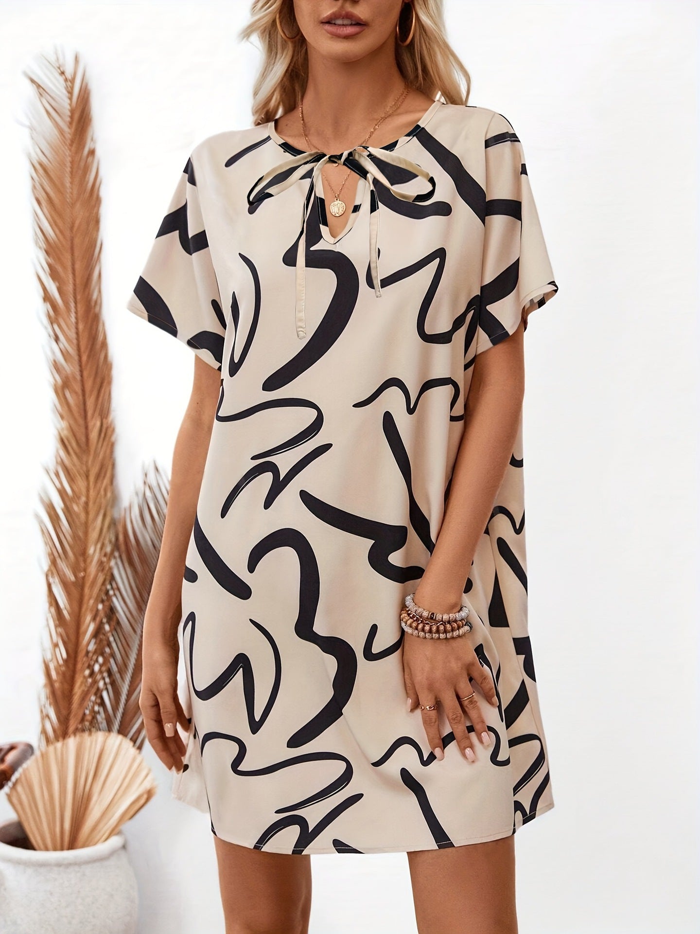 Loose Abstract Print Mini Dress with Tie-Neck