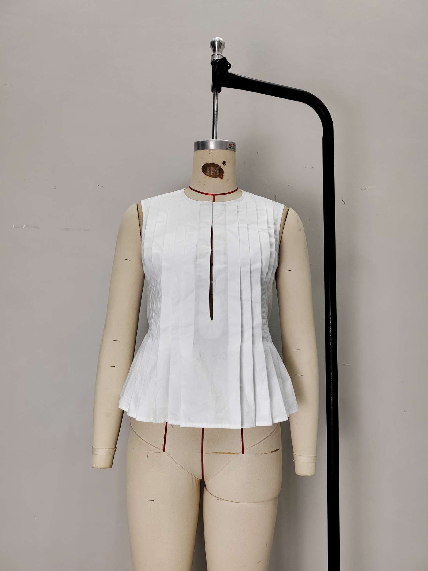 Pleated Peplum Vest with Tie-Back Detail
