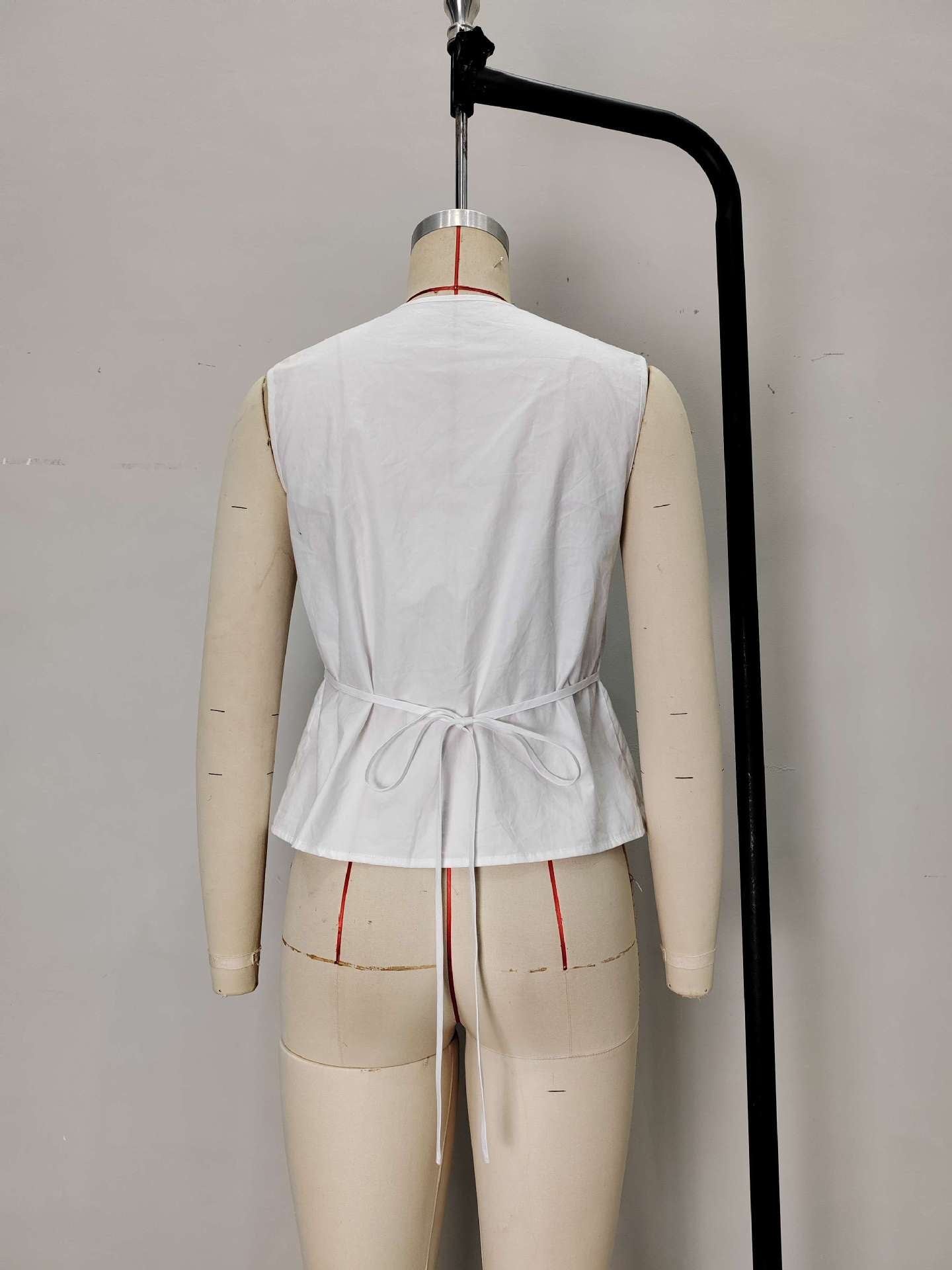 Pleated Peplum Vest with Tie-Back Detail