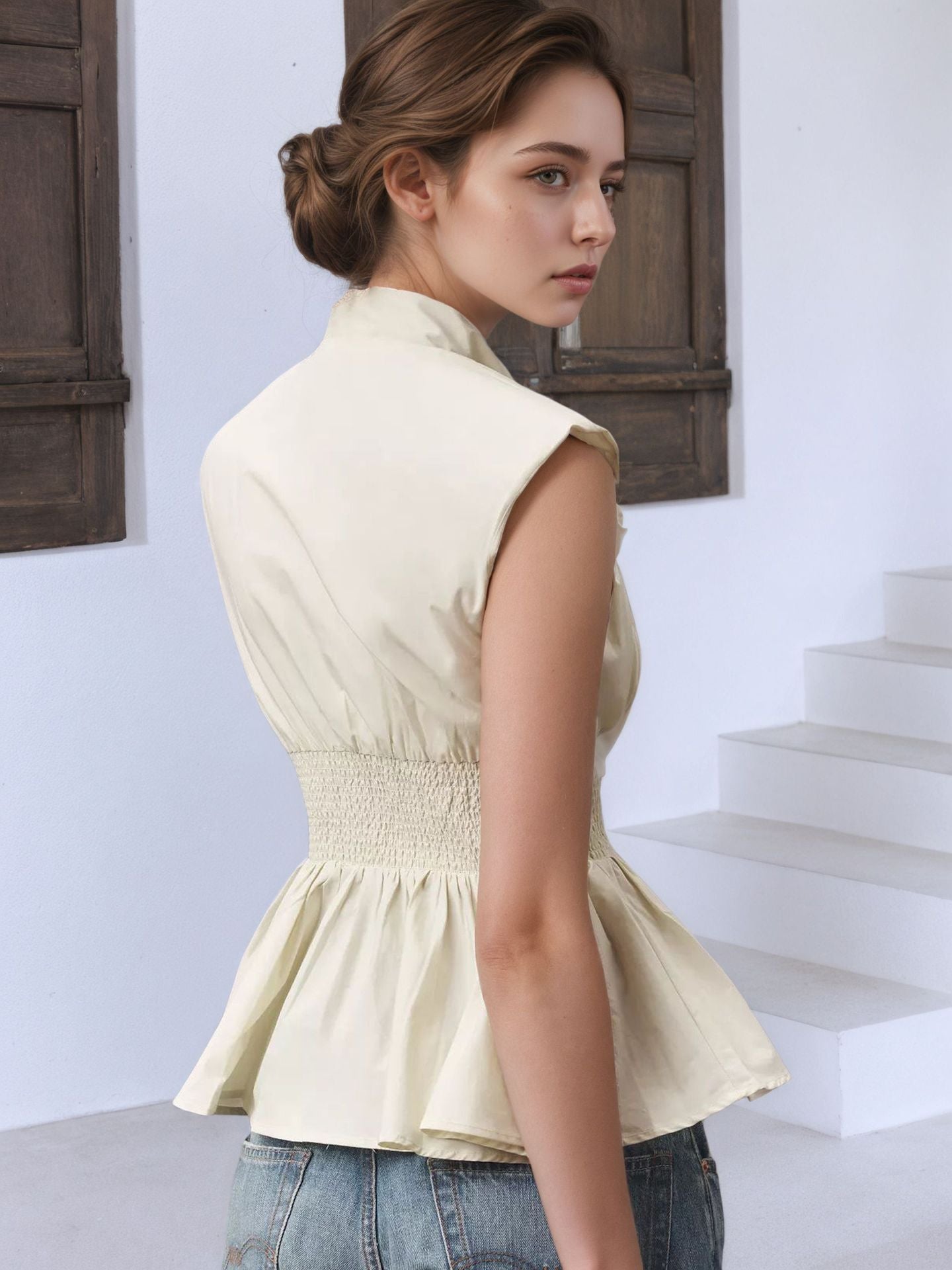 Sleeveless Peplum Top with Deep V-Neck and Front Zipper