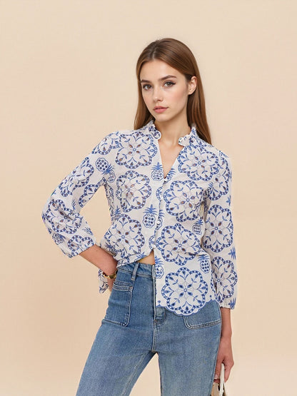 Blue and White Floral Blouse with Ruffled Collar and Scalloped Hem