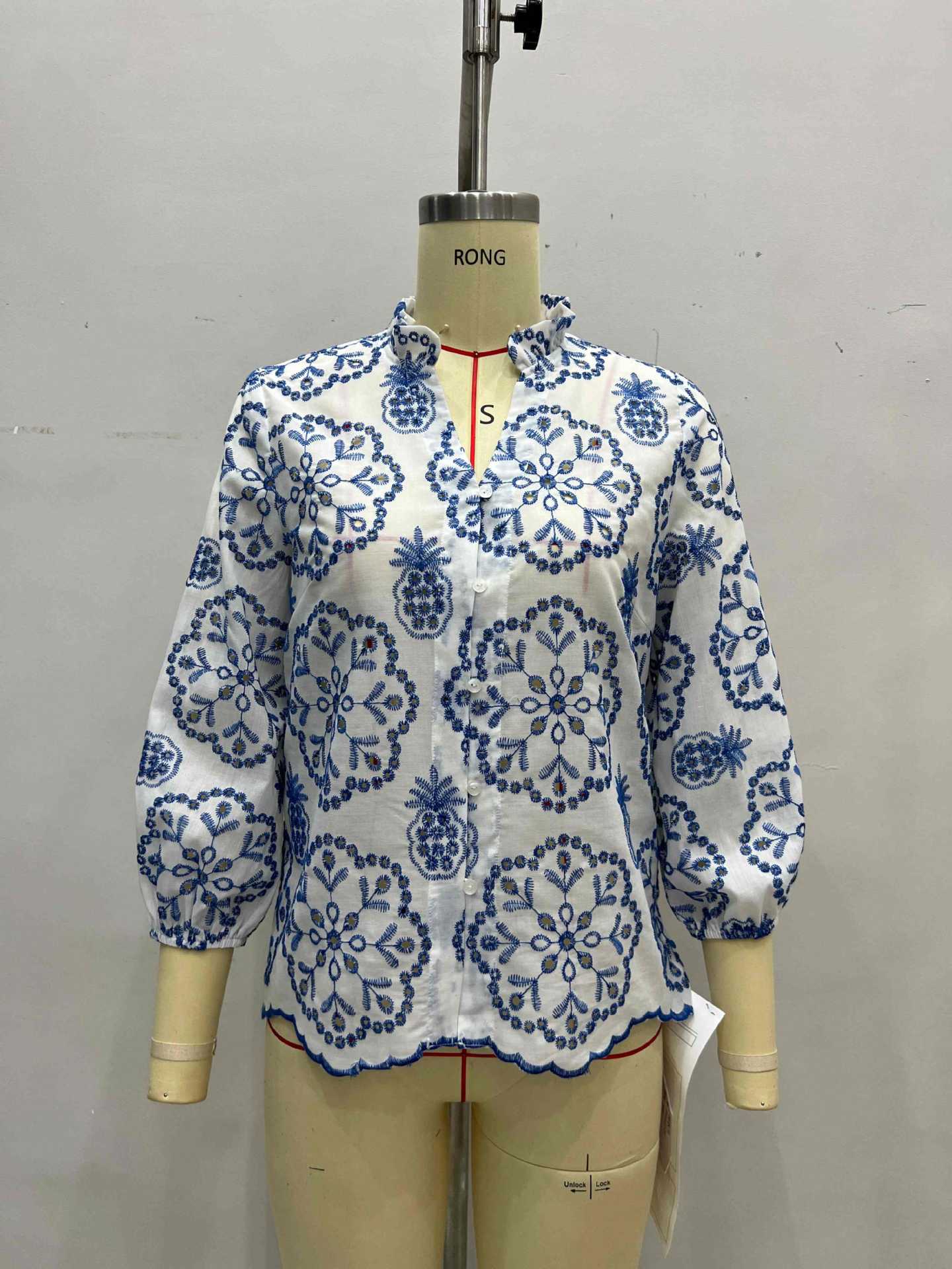 Blue and White Floral Blouse with Ruffled Collar and Scalloped Hem
