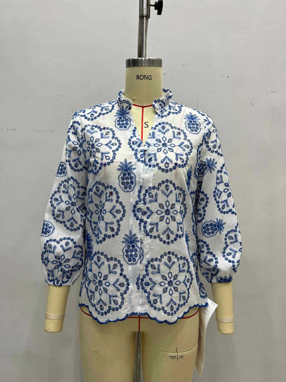 Blue and White Floral Blouse with Ruffled Collar and Scalloped Hem