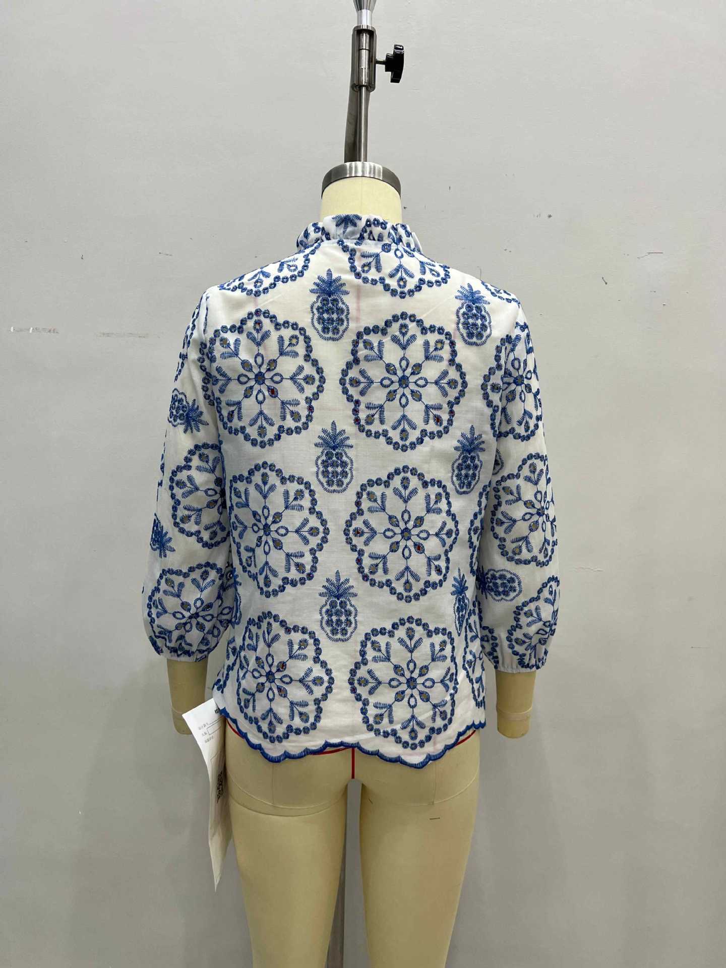 Blue and White Floral Blouse with Ruffled Collar and Scalloped Hem