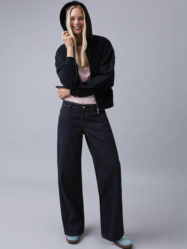 Low-rise baggy studded jeans