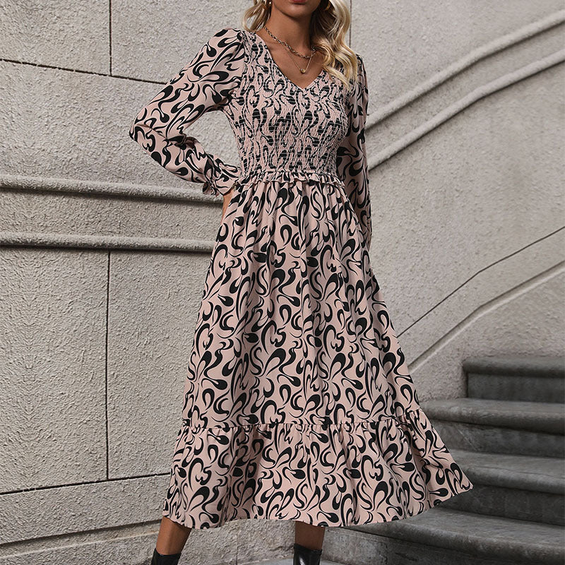Abstract Print Dress with V-Neck and Smocked Bodice