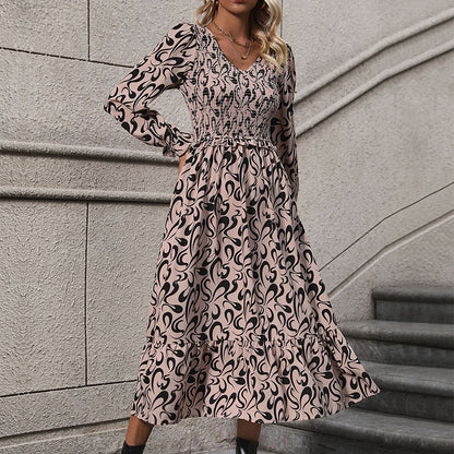 Abstract Print Dress with V-Neck and Smocked Bodice