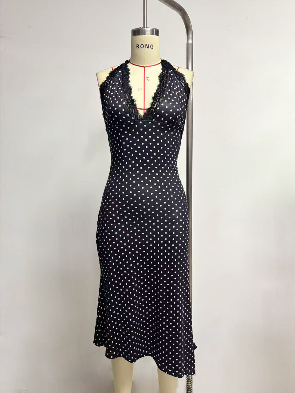 Polka Dot Halter Midi Dress with Lace Trim and Asymmetrical Hem